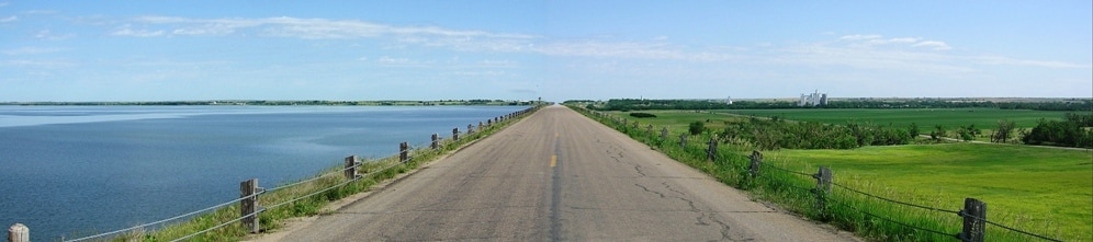 A panaramic photo of the dam road looking north toward Glen Elder, Kansas on the far left and Waconda Lake on the left.